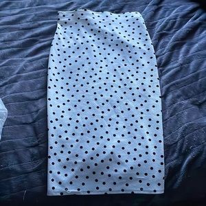 Black and white polka dot fitted skirt.